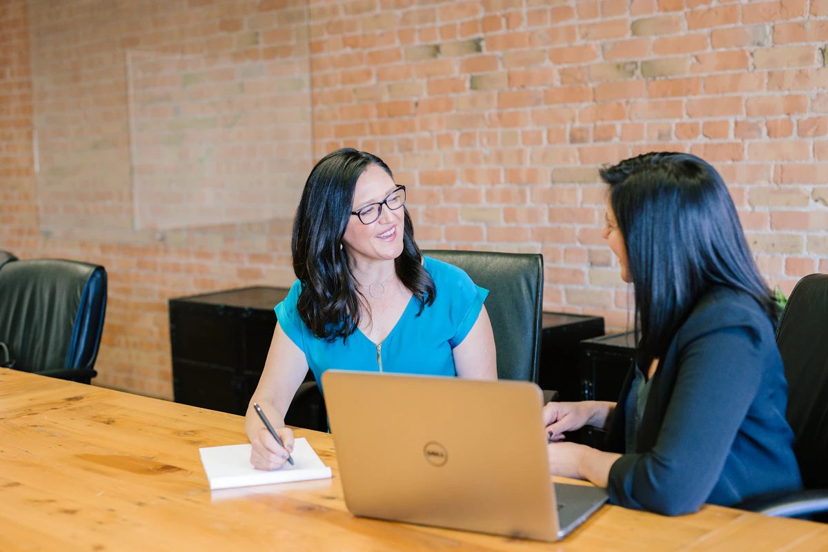 Licensed Ontario real estate agent tutoring a student one on one at a table in Toronto