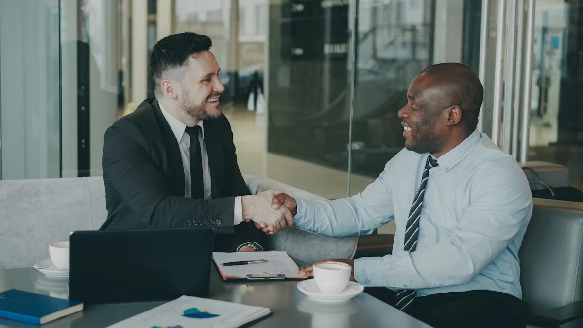 Newly registered Ontario real estate agent shaking hands with a broker after joining a brokerage