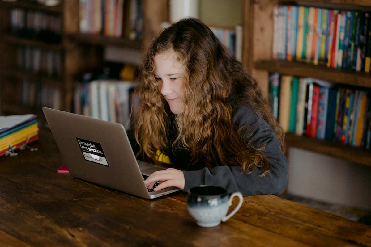 Student working through the Ontario real estate salesperson course material on a laptop at home