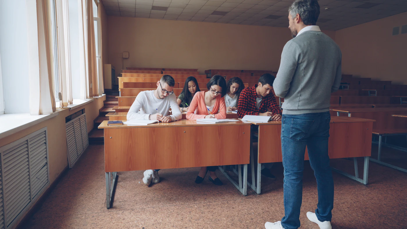Licensed real estate instructor teaching a group of students preparing for their Ontario licensing exams