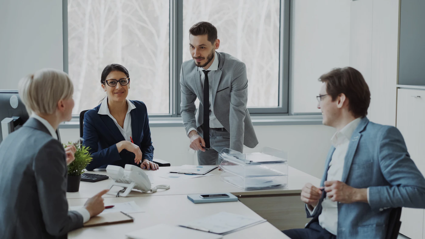 Team of licensed real estate professionals planning tutoring sessions around a table in Toronto